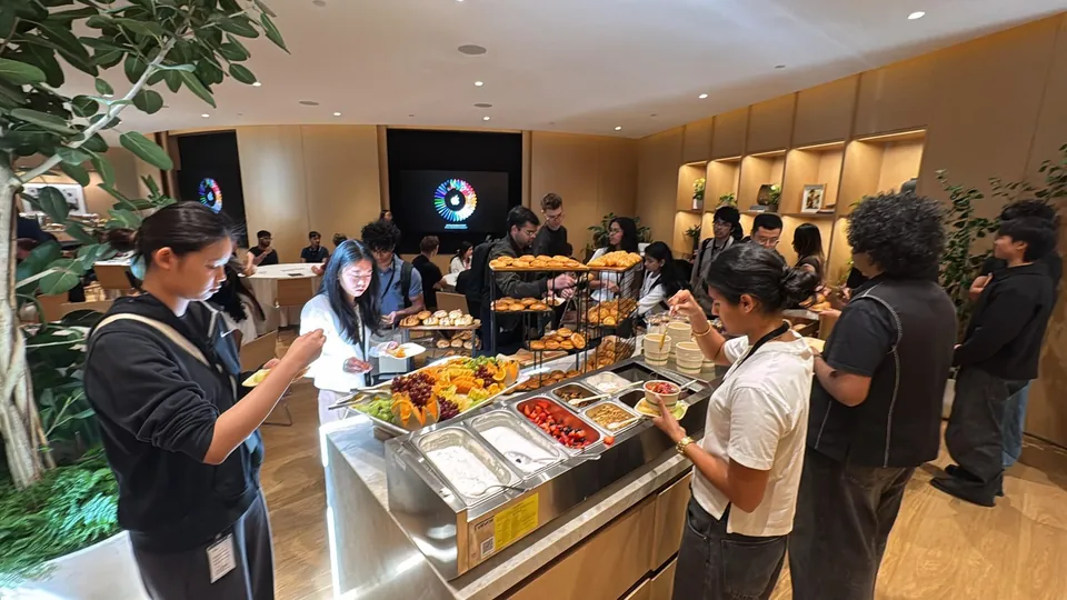 Caterman team serving a hot buffet at an office lunch
