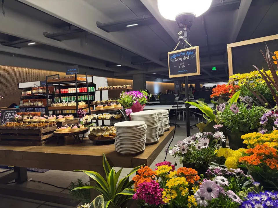 Indoor buffet with stacked plates and fresh flowers