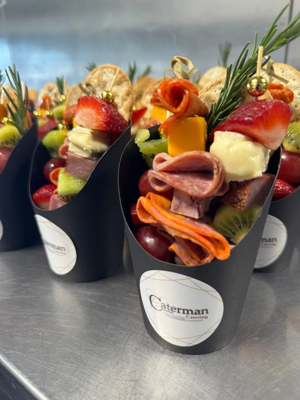 Caterman cones filled with cured meats, cheese and crudités